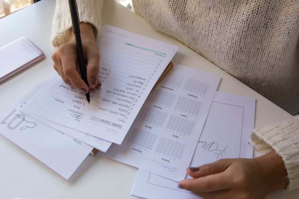 Woman writing in her planner